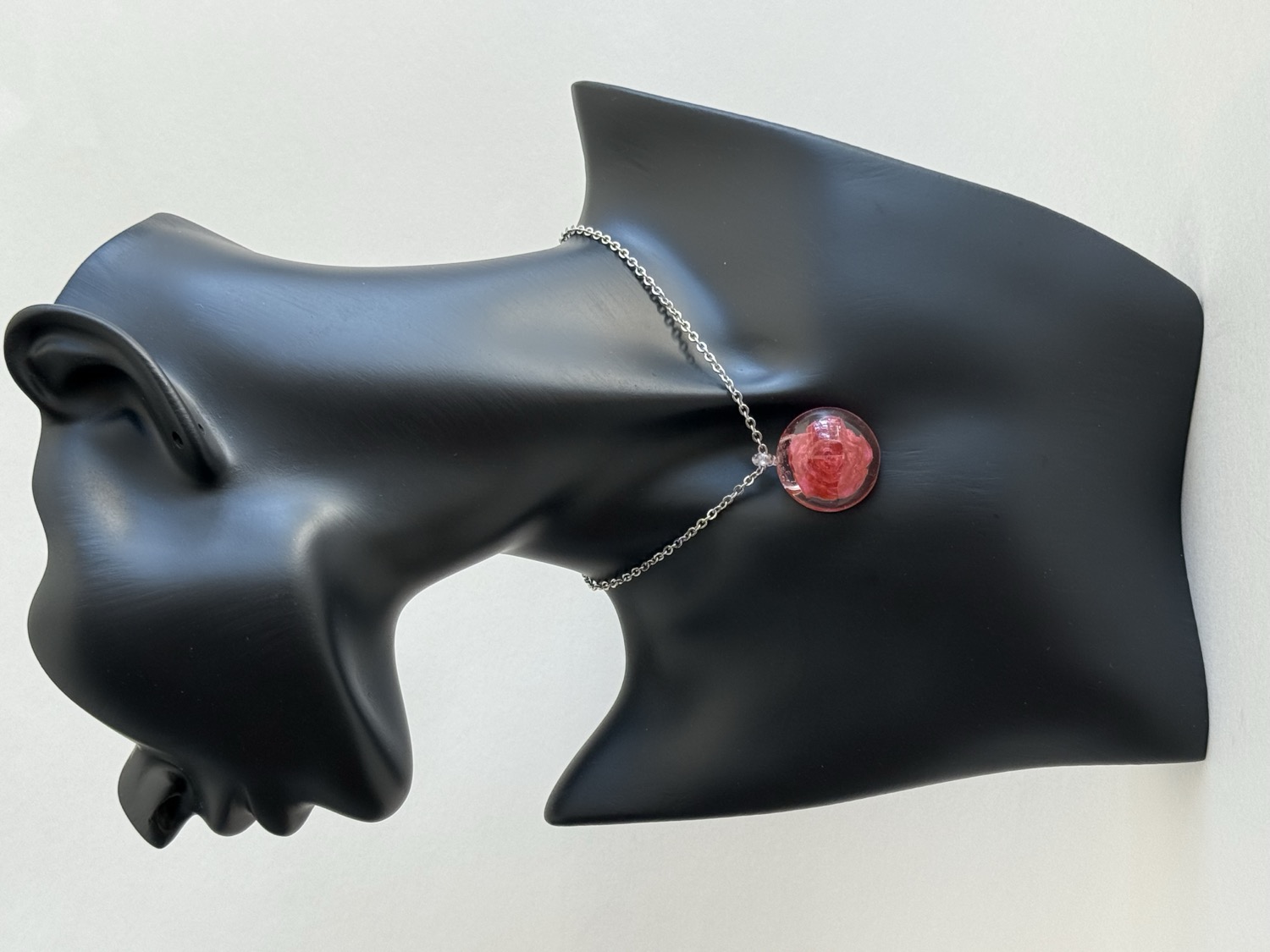 Clear ball with red rose pendant