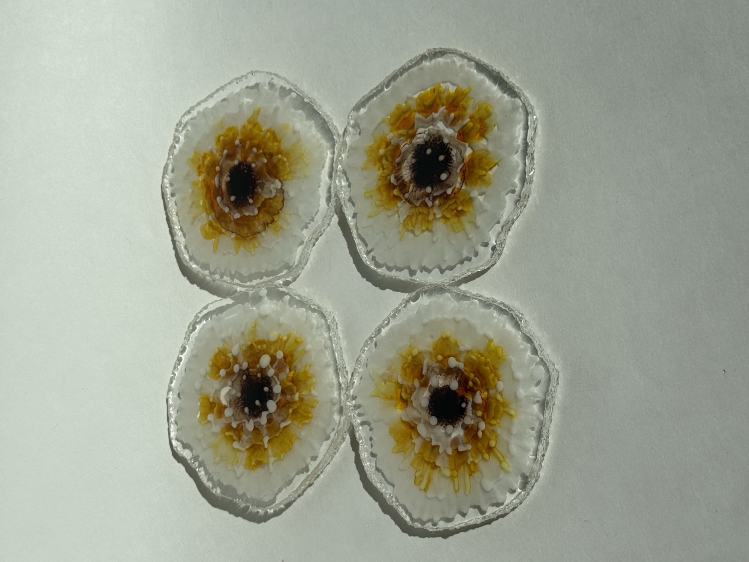 White clear coasters with yellow sunflower