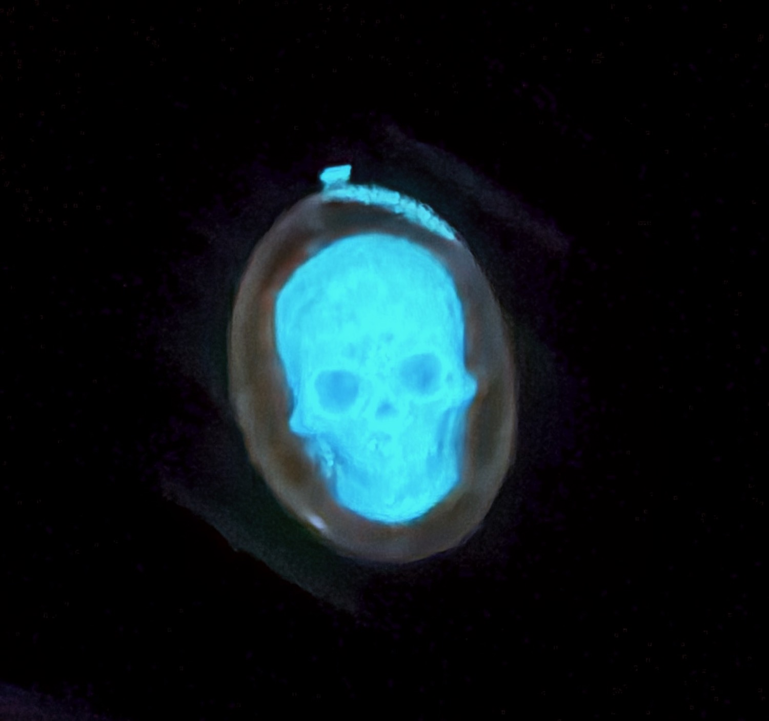 Glow-in-the-dark skull pendant