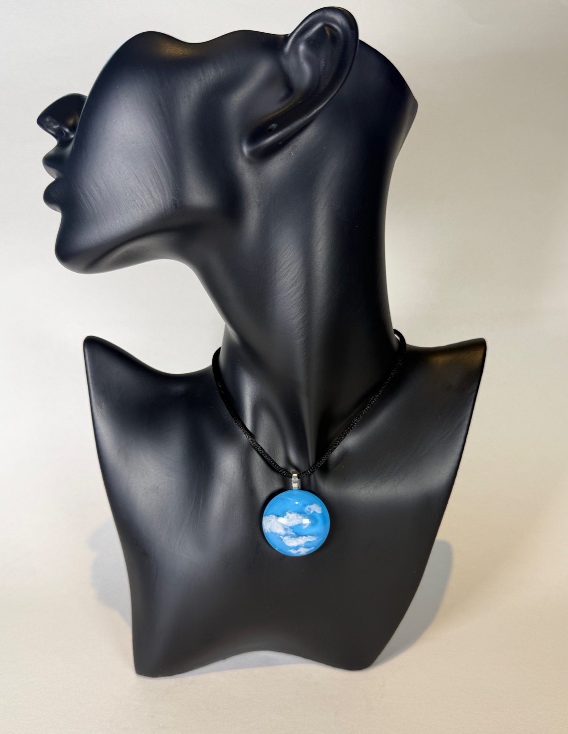 Round blue sky pendant with white clouds