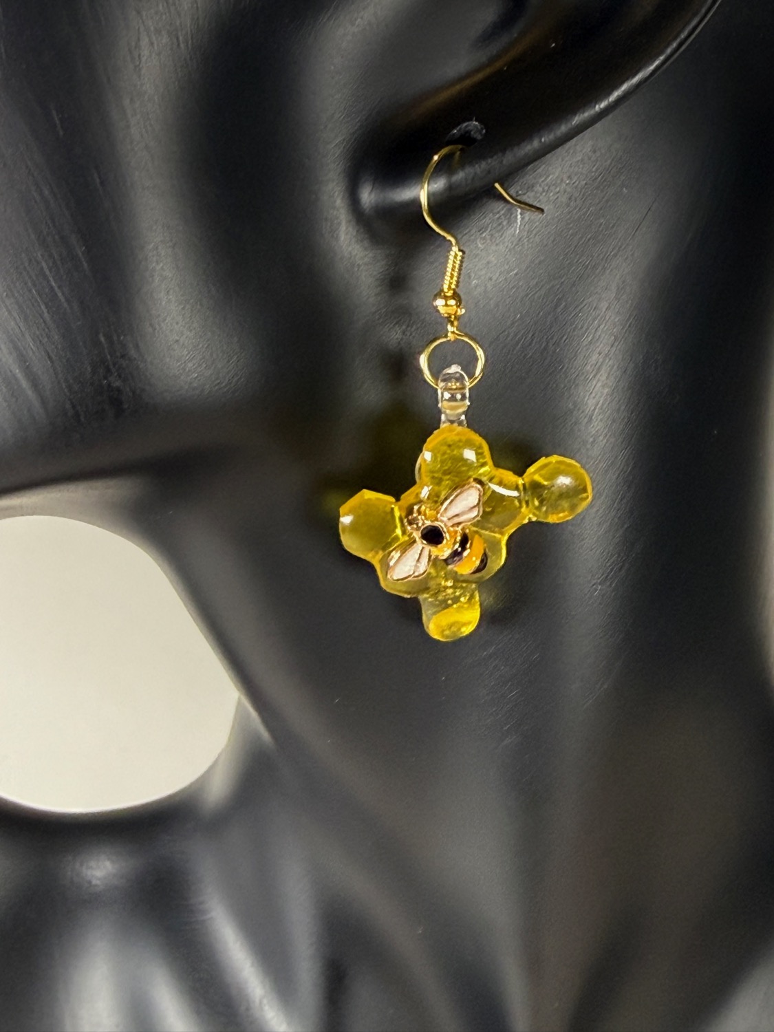 Gold flower earrings view 2