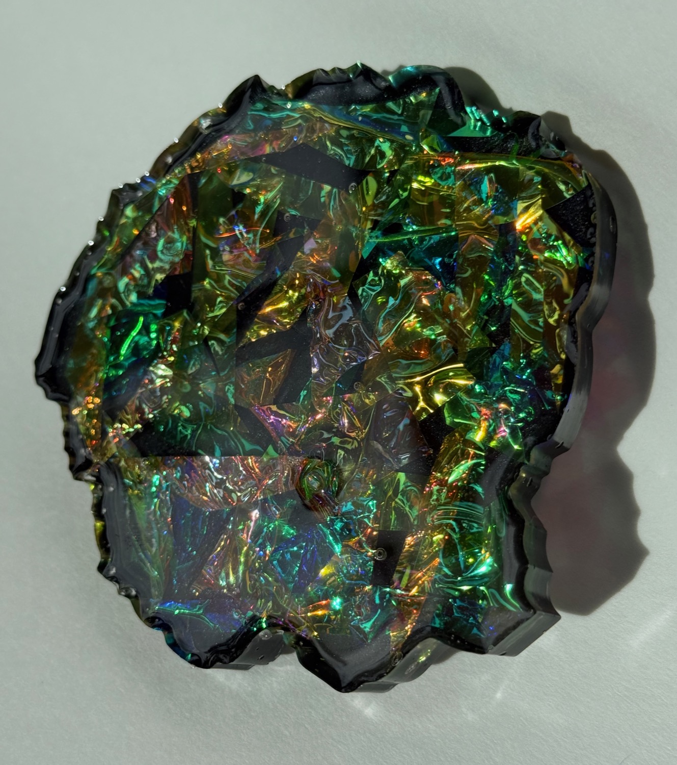 Dark Prism coaster with iridescent rainbow foil shards