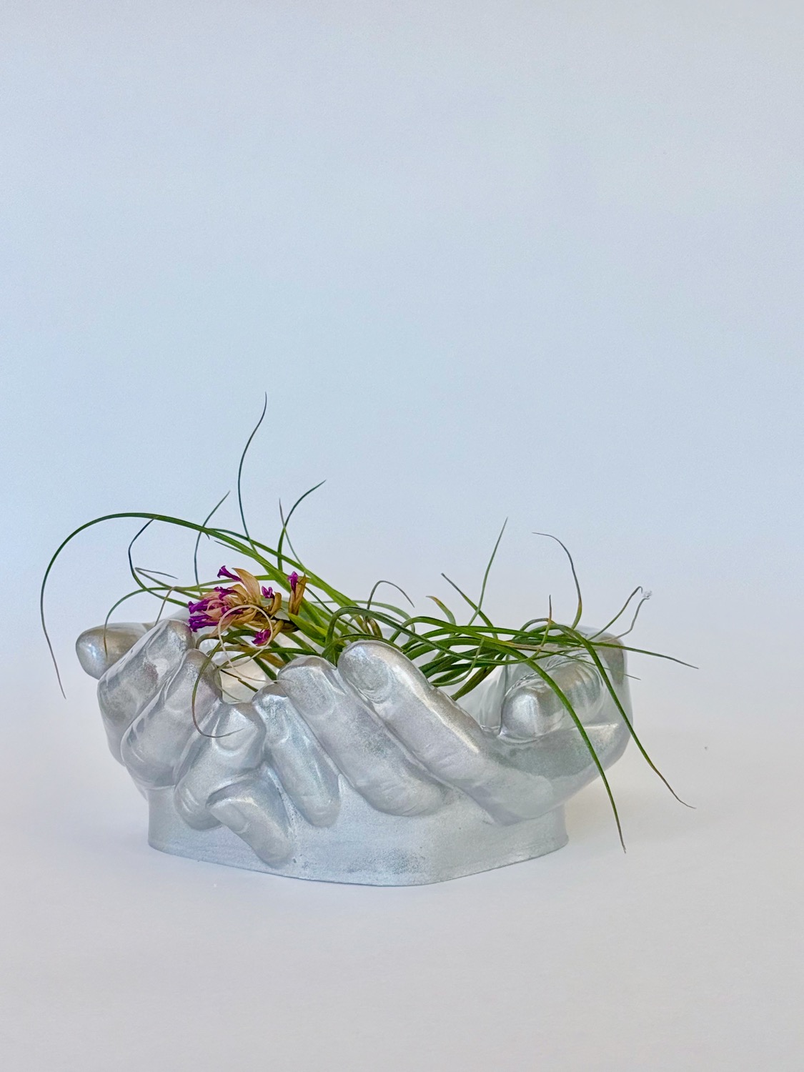 Air Plant Hands — silver pearl resin cupped hands holding an air plant