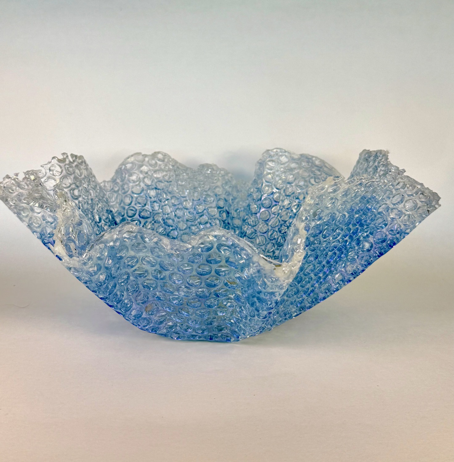 Bubble Wrap Bowl — light blue ruffled resin bowl with bubble texture
