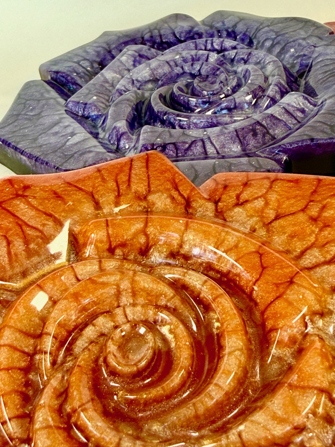 Purple and orange Crackling Rose coasters close-up