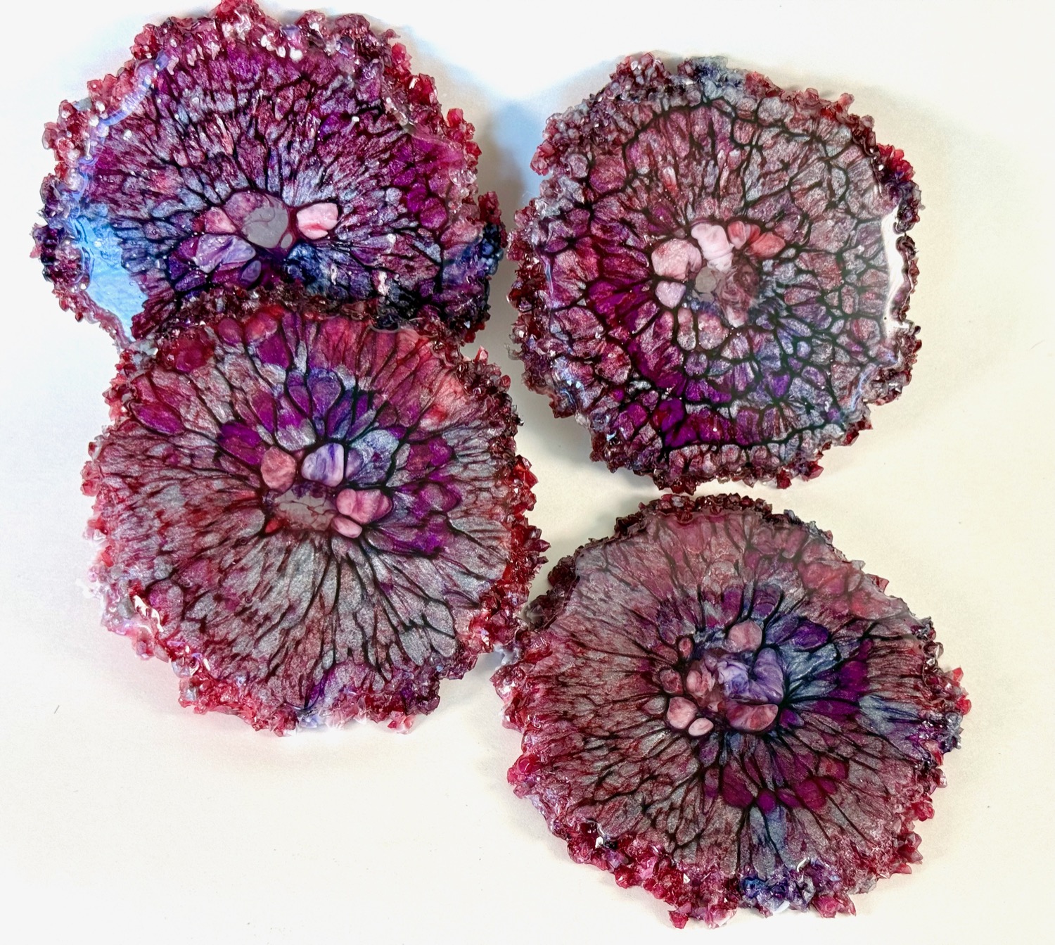 Set of 4 deep crimson geode resin coasters with red crystal edges