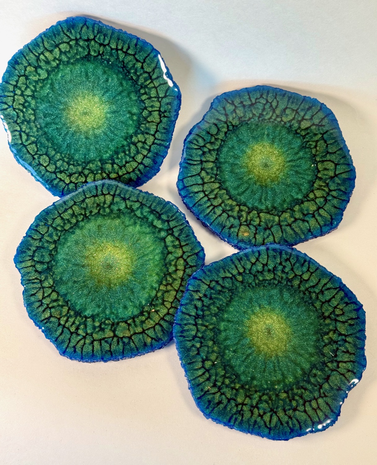 Set of 4 teal crackle geode resin coasters with blue edges