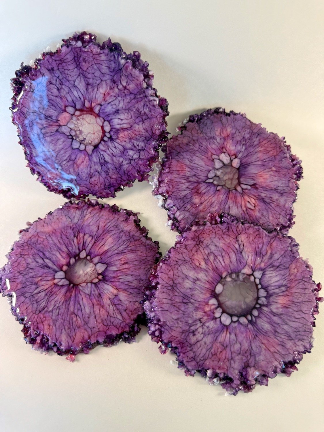 Set of 4 purple pink flower resin coasters with amethyst crystal edges
