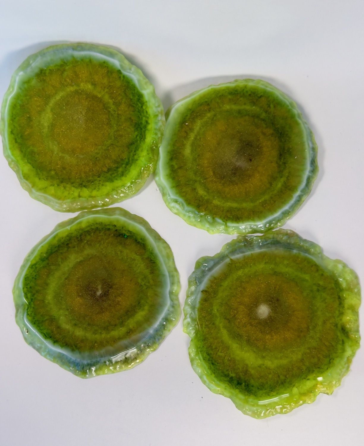 Set of 4 olive green geode resin coasters with gold glitter centres and crystal edges