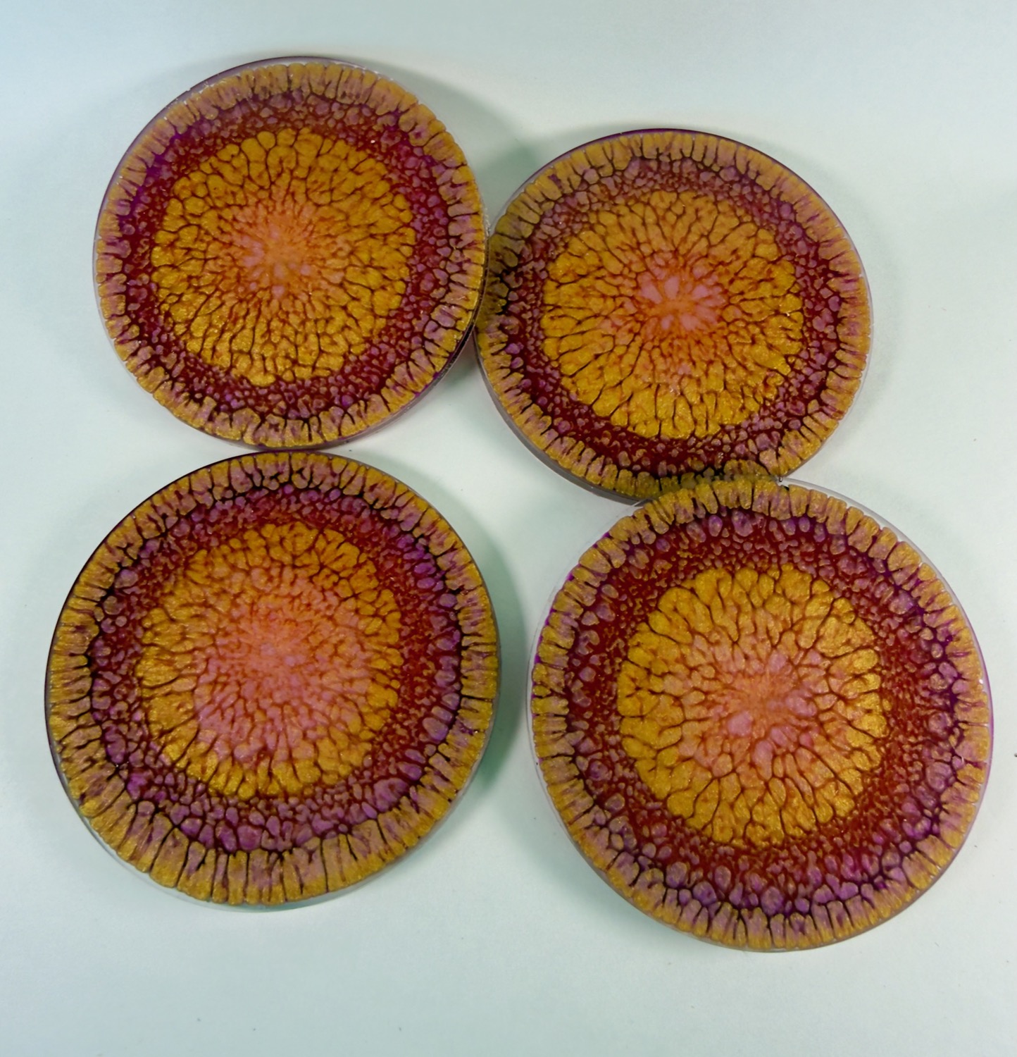 Set of 4 round orange, gold and magenta mandala sunburst resin coasters