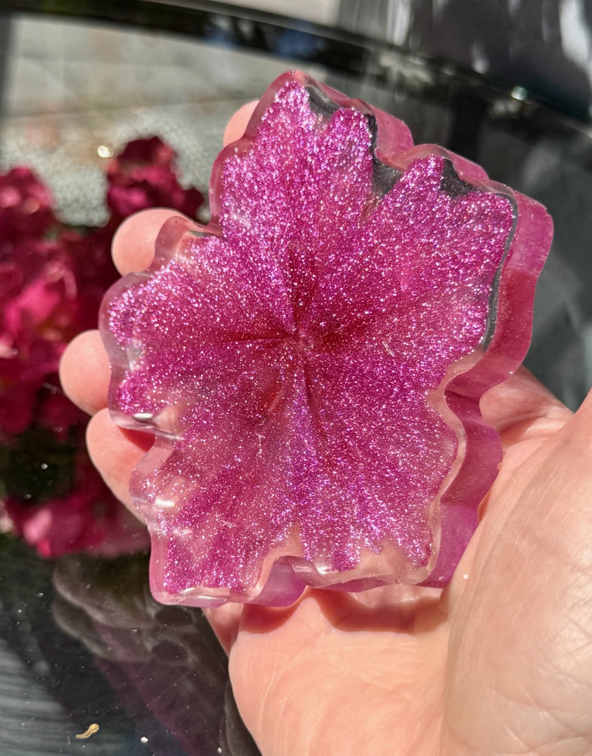 Orchid Blossom coaster held in hand outdoors 2