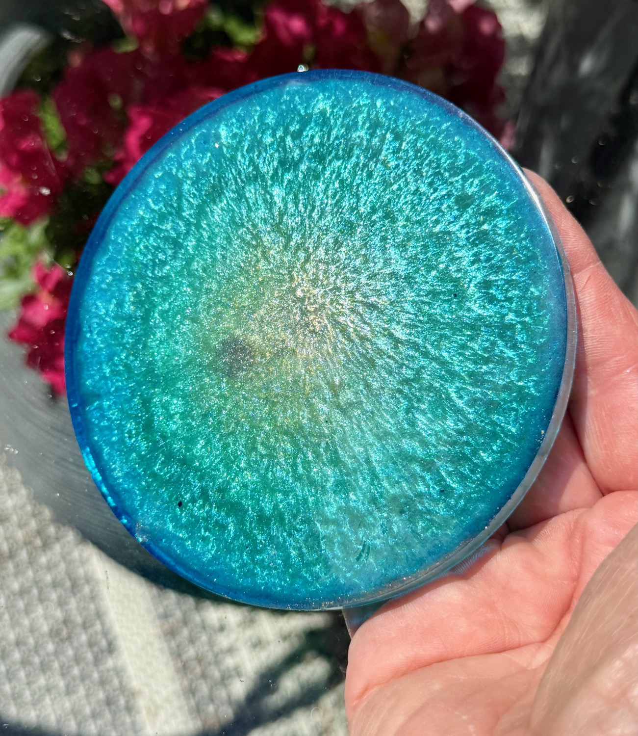 Mermaid Geode coaster held in hand outdoors
