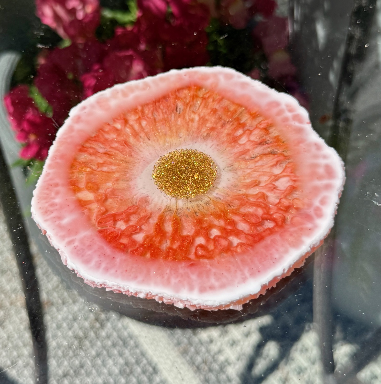 Coral Sunburst coaster outdoor view