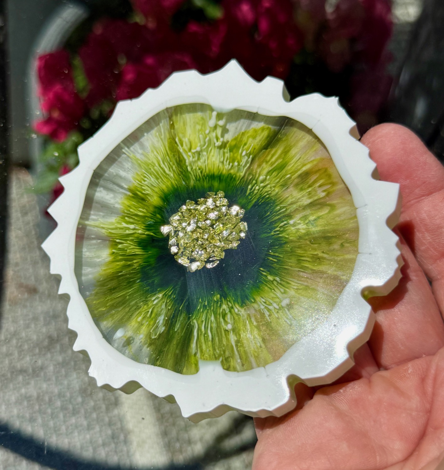 Cornflower Blossom coaster held in hand outdoors