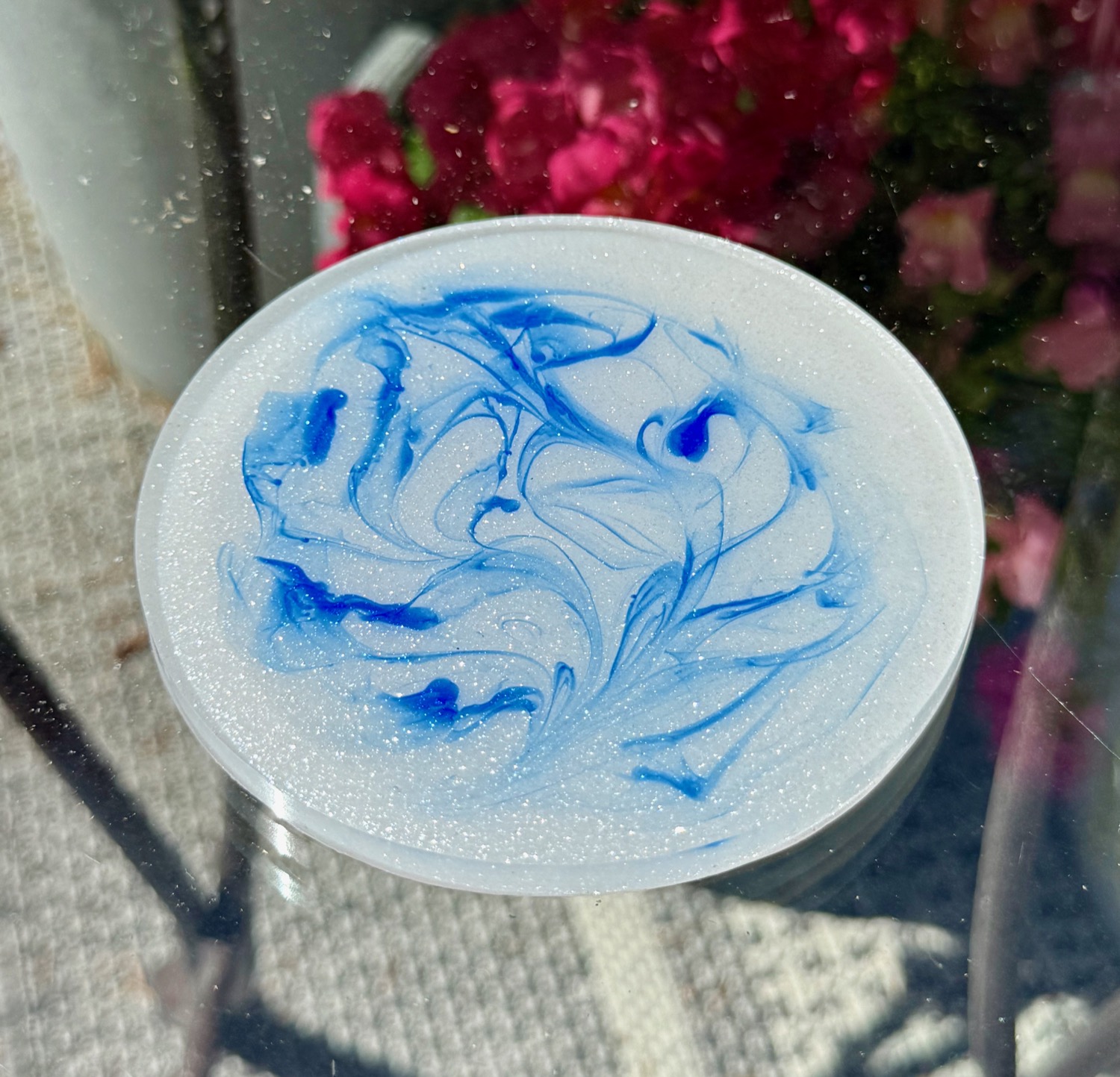 Blue Marble coaster held in hand outdoors