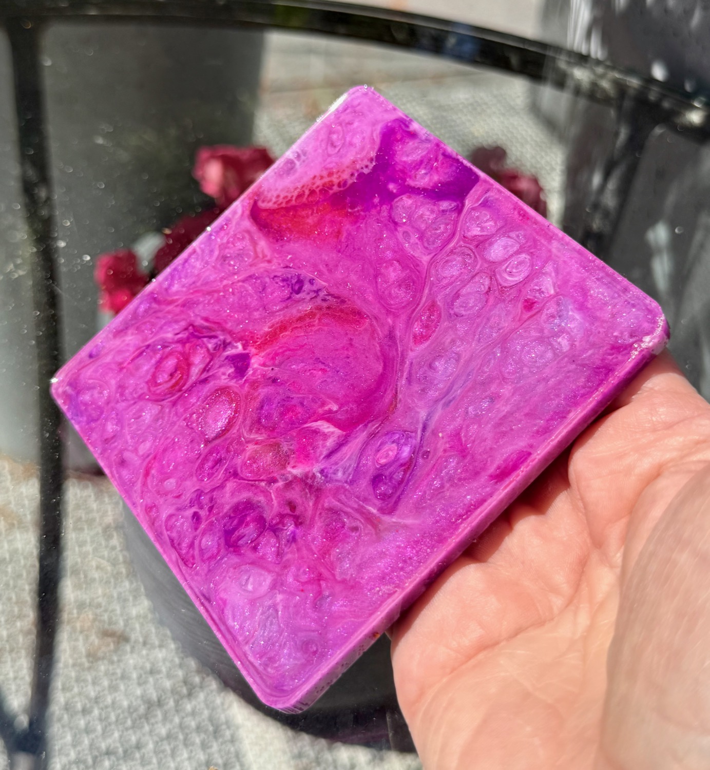 Berry Marble coaster held in hand outdoors
