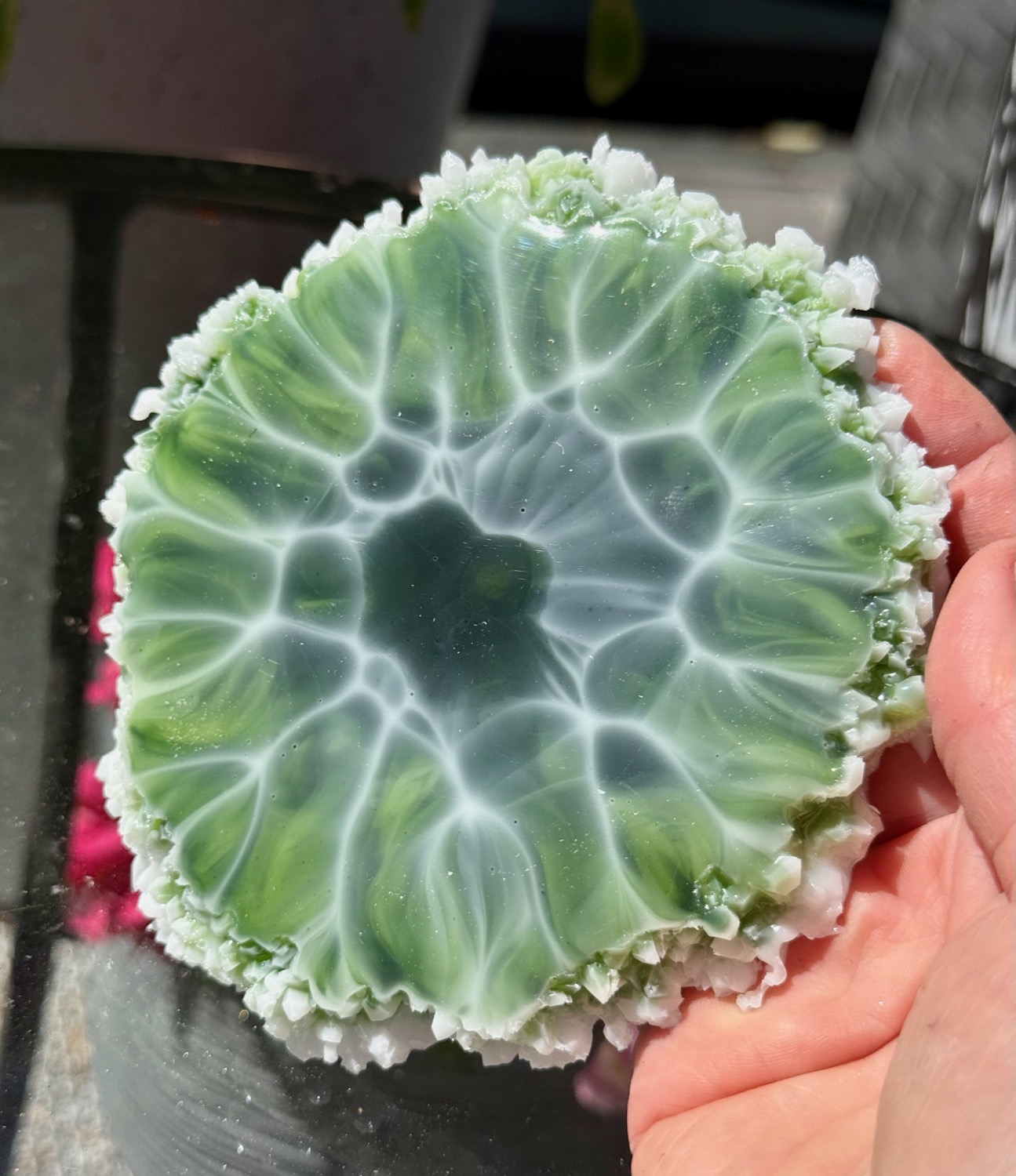 Emerald Geode coaster held in hand