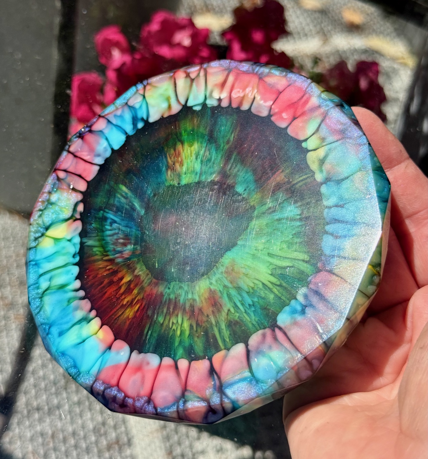 Prism Eye coaster held in hand