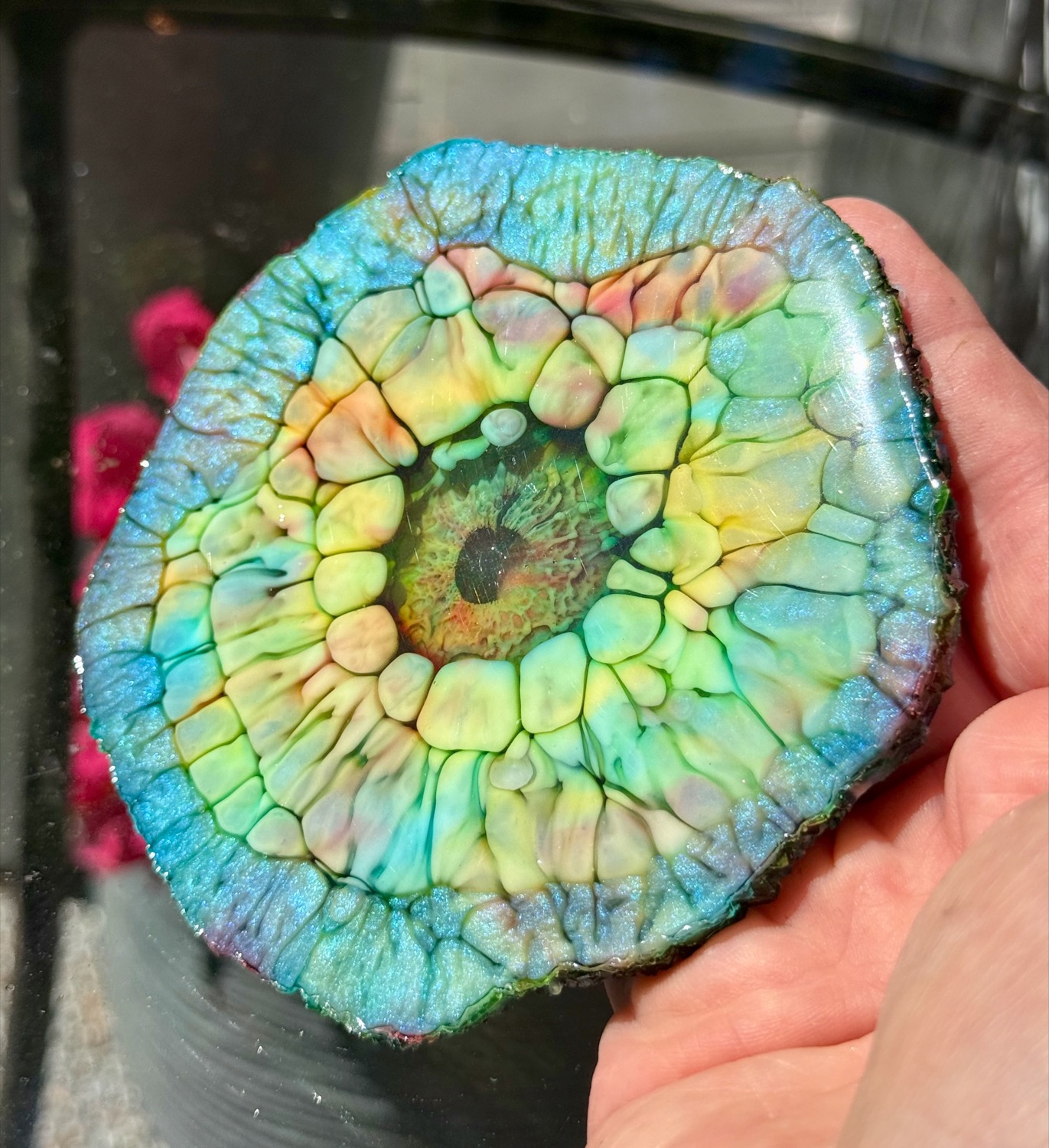 Tide Pool coaster held in hand outdoors