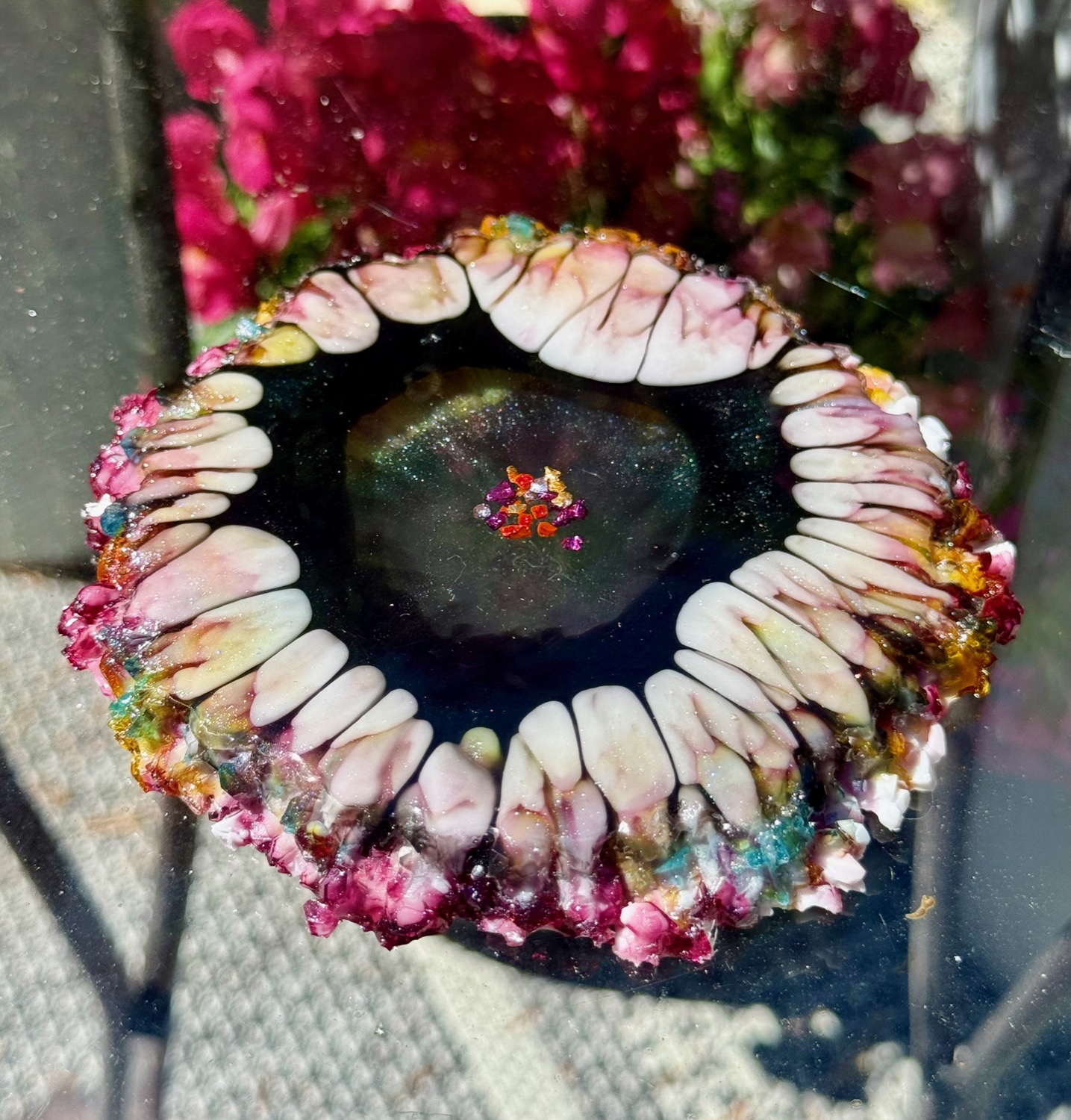 Galaxy Petal coaster held in hand outdoors